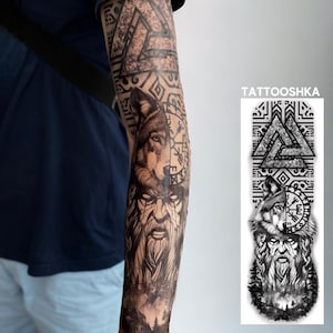 May include: A black and white temporary tattoo design featuring the text TATTOOSHKA, a Valknut symbol, a wolf head, a bearded figure, and a forest landscape. The design is displayed on an arm and as a separate vertical rectangular graphic.
