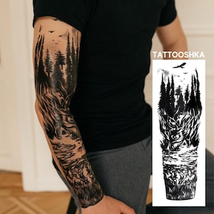 May include: A black and white temporary tattoo design featuring a forest landscape with tall pine trees, a flying bird, and a wolf head integrated into the scenery. The design includes the text TATTOOSHKA at the top of the rectangular display.