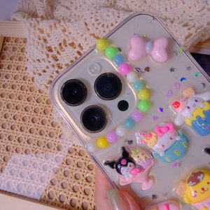 Phone case, camera area close up, colorful pompon