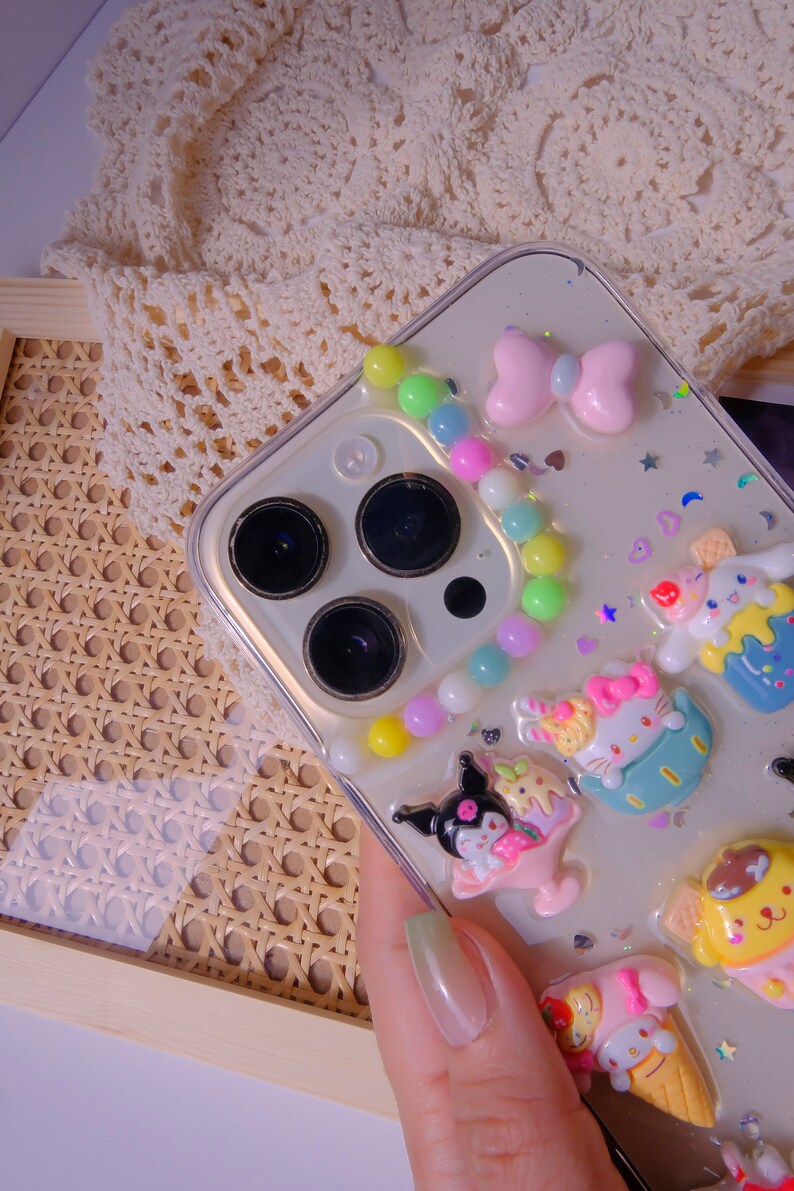 Phone case, camera area close up, colorful pompon