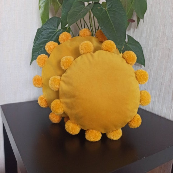 mustard round pillow