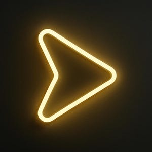May include: A neon yellow arrow-shaped light fixture against a dark gray wall. The arrow points to the right, with a rounded tip and a sharp angle. The light has a soft glow.