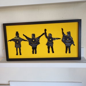 The Beatles Help! Unique art work. Sculptured vinyl silhouettes from original 1960&#39;s 7 inch singles. Signed by the artist. Made in Liverpool