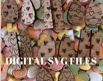 May include: A set of digital SVG files for laser cutting earrings. The earrings are made of wood and feature a heart pattern. The earrings are shown on a background of colorful candy hearts.