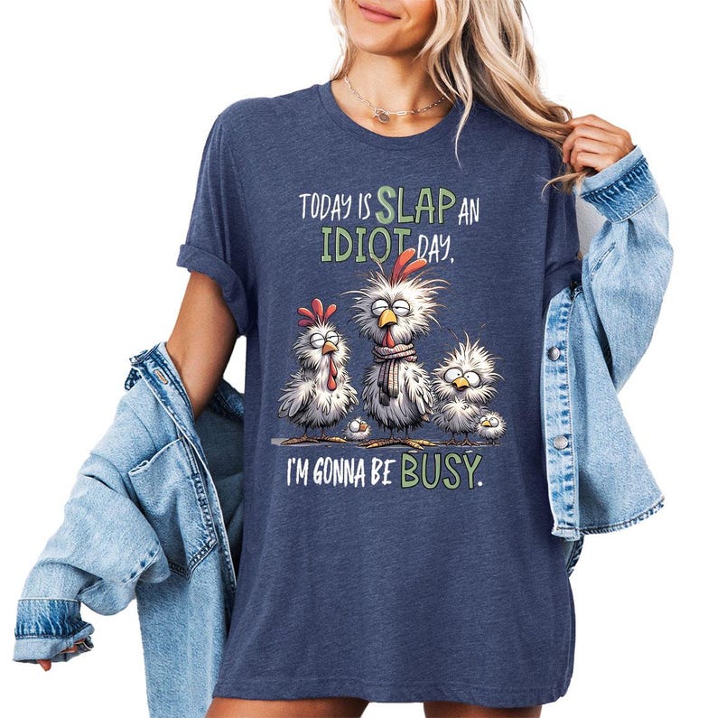 a woman wearing a blue shirt that says today is slap an idiot i'm