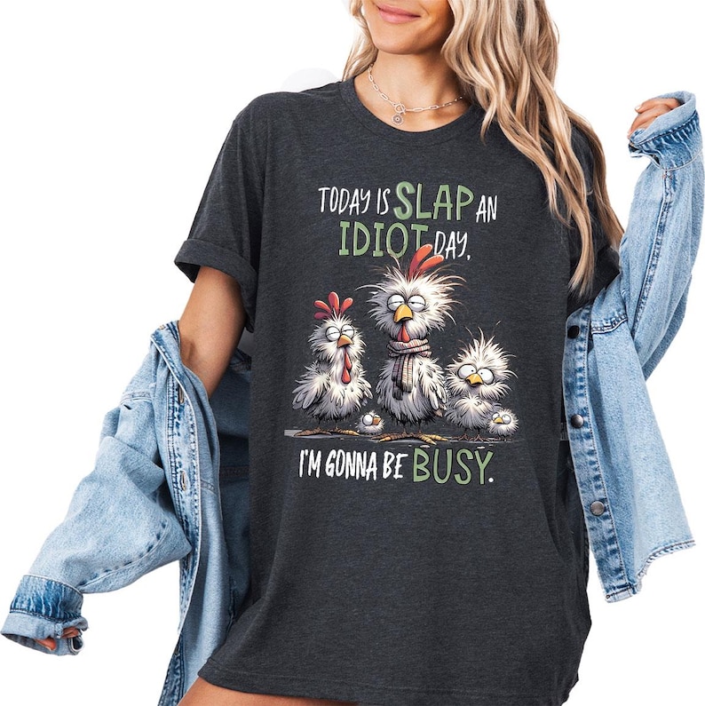 a woman wearing a black tshirt that says today is slap an idiot day
