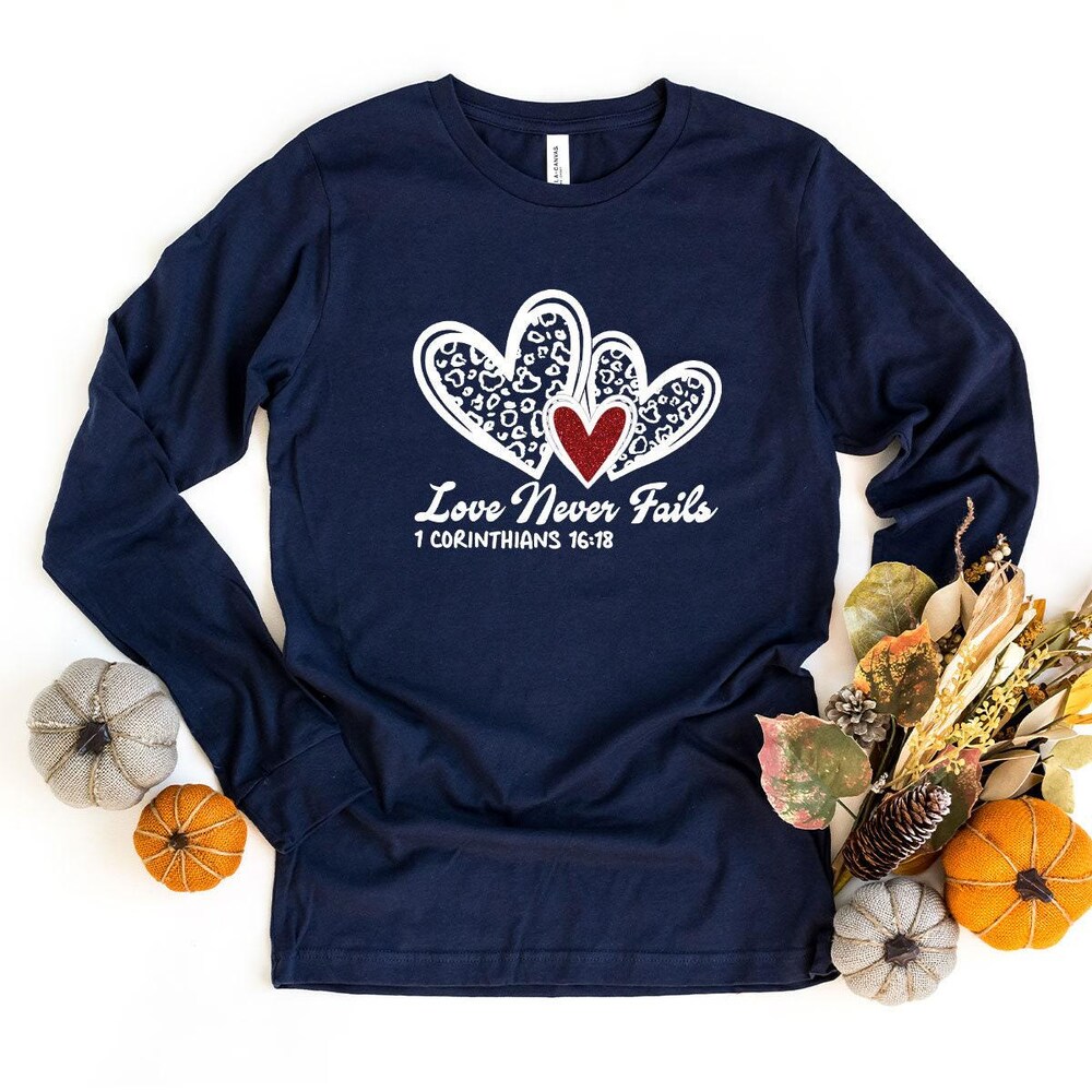 Love Never Fails Long Sleeve T-Shirt, Religious Love Long Sleeve T Shirt, Leopard Heart Long Sleeve Shirt, Christmas Gift Long Sleeve Shirt Designed By Shirttrendz