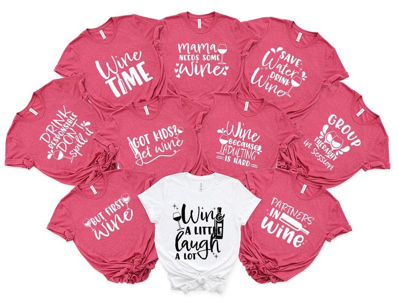 a bunch of shirts that are on a white surface