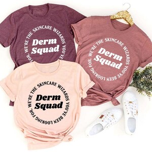 three t - shirts that say derm squad on them