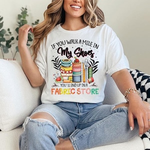 a woman sitting on a couch wearing a white shirt