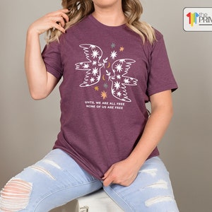 a woman sitting on a stool posing for a picture