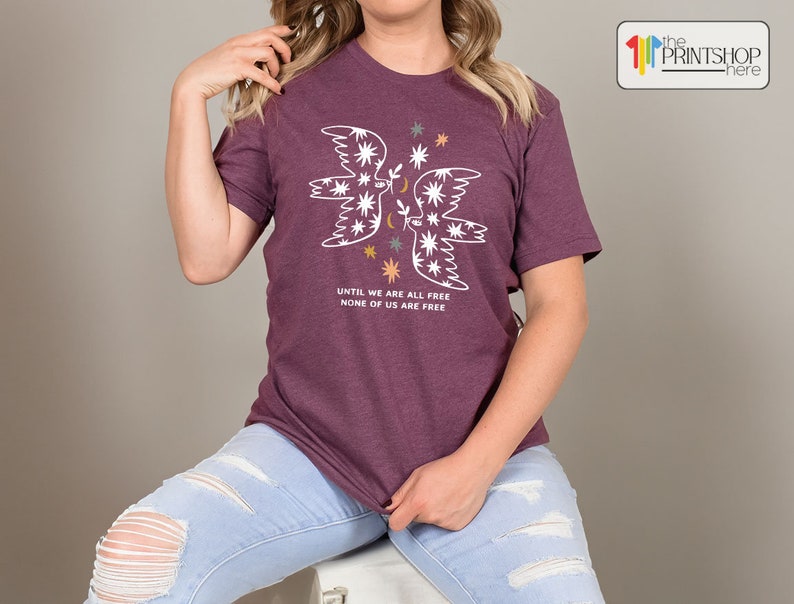 a woman sitting on a stool posing for a picture