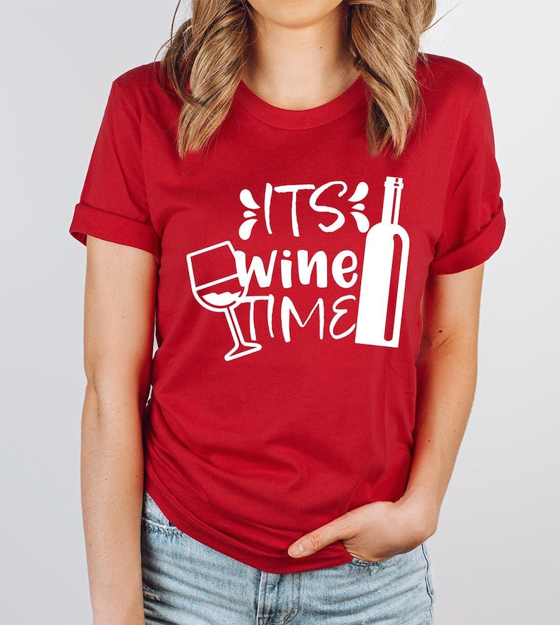 a woman wearing a red tshirt that says its wine time