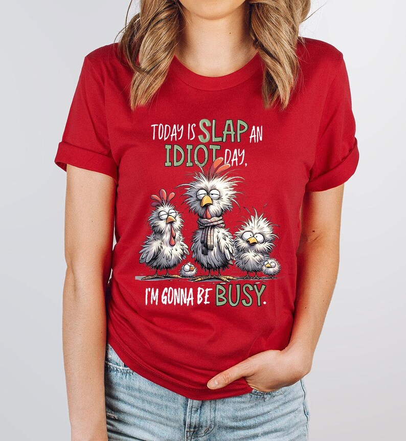 a woman wearing a red shirt that says today is slap an idiot day i '