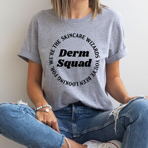 a woman sitting on the floor with her legs crossed