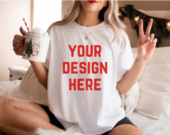 May include: White t-shirt with the text "YOUR DESIGN HERE" in red letters.