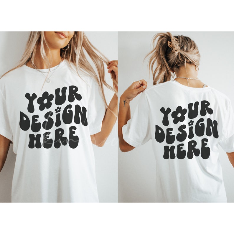 May include: White t-shirt with a black graphic that says "YOUR DESIGN HERE" in a retro font with a flower design.