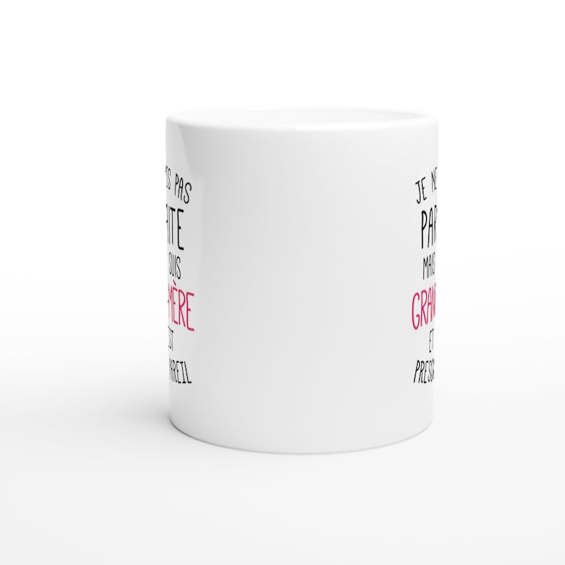 May include: White ceramic mug with black text that reads "Je ne suis pas parfaite mais je suis grave et press&eacute;e".