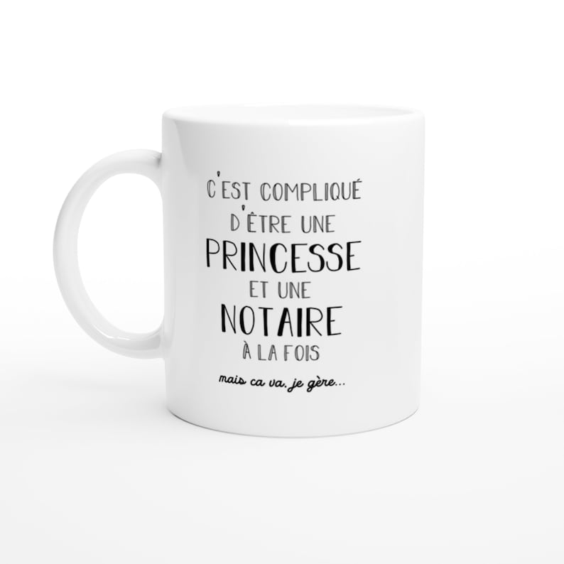 May include: White ceramic mug with black text that reads "C'EST COMPLIQU&Eacute; D'&Ecirc;TRE UNE PRINCESSE ET UNE NOTAIRE &Agrave; LA FOIS mais ca va, je g&egrave;re..."