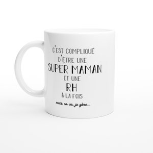 May include: White ceramic mug with black text that reads "C'EST COMPLIQU&Eacute; D'&Ecirc;TRE UNE SUPER MAMAN ET UNE RH &Agrave; LA FOIS mais ca va. je g&egrave;re..."