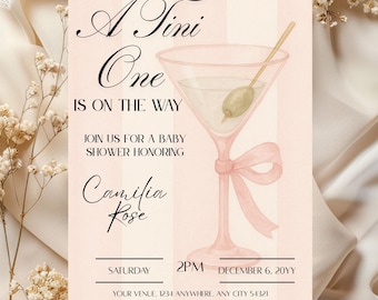 May include: A baby shower invitation featuring a watercolour martini glass with an olive. The invitation includes the text "A Tini One is on the Way" and event details, including the name "Camilia Rose".