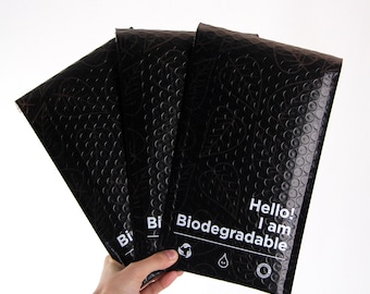 May include: Three black biodegradable mailing envelopes with a leaf pattern and the text "Hello! I am Biodegradable".