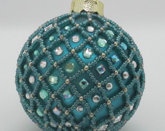 Christmas balls made of glass of 6 cm, with seed cailles in mesh technology