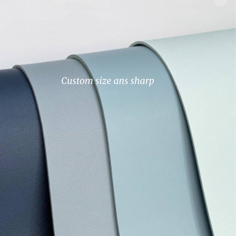 May include: Four samples of leather in different shades of blue, from dark blue to light blue. The text "Custom size ans sharp" is written on the samples.