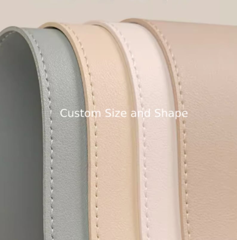 May include: Four leather strips in different colors: gray, beige, white, and light pink. The strips are stitched along the edges and have a smooth, textured surface. The text "Custom Size and Shape" is printed on the strips.