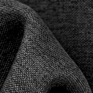 May include: Close-up of a black woven fabric with a textured surface.