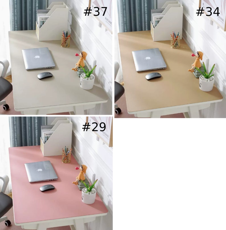 May include: Three different colored desk mats, one gray, one beige, and one pink. Each mat has a laptop, a mouse, a small potted plant, and a small figurine on it. The mats are all on white desks with white chairs.