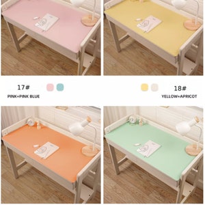 May include: Four different colored desk mats with a white desk and a lamp on each. The mats are pink, yellow, orange, and green. The text on the image reads "17# PINK+PINK BLUE", "18# YELLOW+APRICOT", "19# ORANGE+LIGHT BLUE", and "20# EYE GREEN+TEA POWDER".