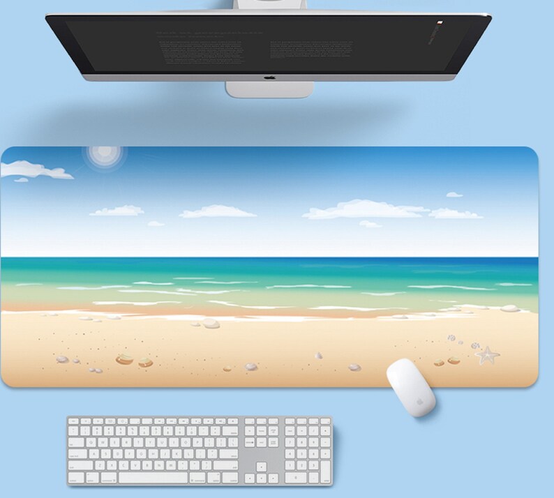 May include: A blue and white beach scene desk mat with a sandy beach, blue ocean, and white clouds. The mat is designed to look like a beach scene.