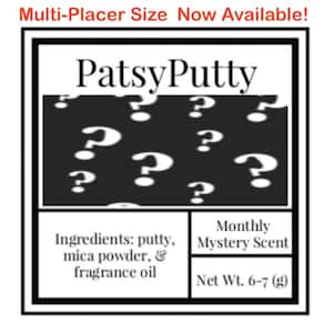 May include: A square product label with a black border featuring the text PatsyPutty at the top. Below is a black section with white question marks. The bottom section lists ingredients as putty, mica powder, and fragrance oil, with Monthly Mystery Scent and Net Wt. 6-7 (g) text.