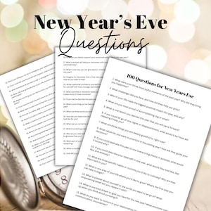 May include: A stack of white paper sheets with New Year's Eve questions printed in black ink. The top sheet has the title "New Year's Eve Questions" in a handwritten font. The questions are designed for self-reflection and goal setting.