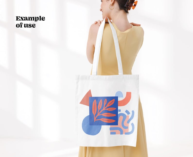 Puede incluir: Bolsa de tela blanca con un dise&ntilde;o abstracto colorido que incluye un tri&aacute;ngulo rojo, un c&iacute;rculo azul y formas rosas y rojas. El dise&ntilde;o tambi&eacute;n incluye una hoja roja y azul.