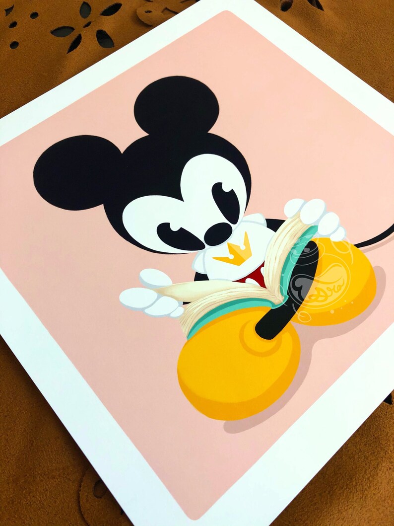 May include: A cartoon illustration of Mickey Mouse wearing a crown and holding a book. The background is pink.