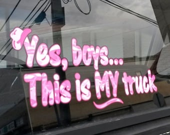 May include: Pink and white camouflage sticker on a car window that reads "Yes, boys... This is MY truck".