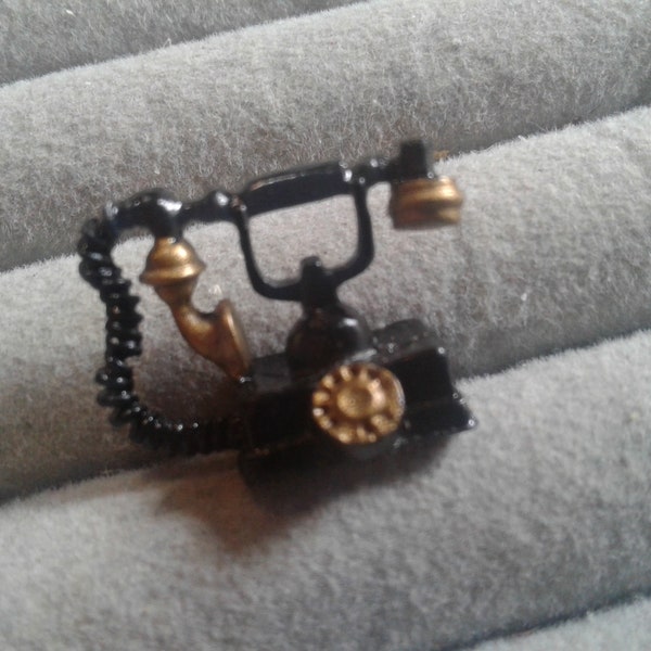 Vintage miniature old fashioned telephone in Black and Gold