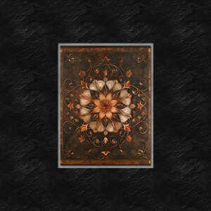 May include: A framed artwork featuring a detailed mandala design with intricate floral patterns in shades of brown, white, and orange. The background is a dark brown color.