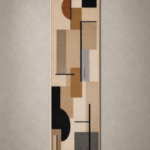 May include: A rectangular runner rug featuring a geometric pattern of overlapping shapes in shades of beige, tan, brown, gray, and black. The design includes solid rectangles, a semi-circle, and thin vertical black lines on a light beige background.