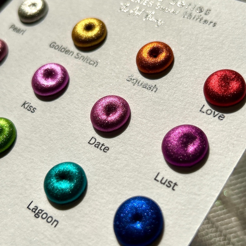 May include: A card with 10 metallic paint samples, each with a different color and name. The colors are: Pearl, Golden Snitch, Kiss, Date, Lagoon, Squash, Lust, Love, and two more.