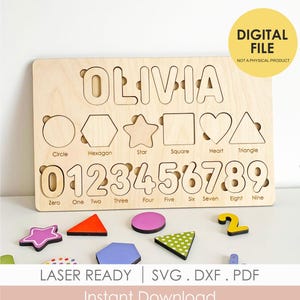 May include: Wooden puzzle board featuring the name "OLIVIA", shapes, and numbers. Includes removable shapes and numbers. The text "DIGITAL FILE" and "LASER READY" are also visible.