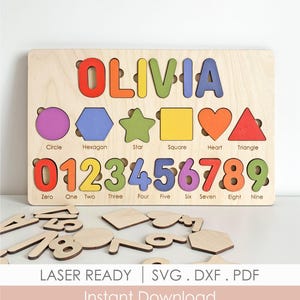 May include: Wooden puzzle board with the name "OLIVIA" in colorful letters. Features shape and number cutouts with corresponding pieces. Includes shapes like circle, hexagon, star, square, heart, and triangle. Numbers 0-9 are also included. The text "LASER READY | SVG. DXF. PDF Instant Download" is at the bottom.