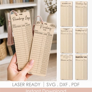 May include: Two rectangular light wood bookmarks featuring laser-engraved reading logs with columns for title, author, date, and star ratings. Each bookmark has a hole at the top with a dusty pink tassel attached. The text Reading Log is engraved.