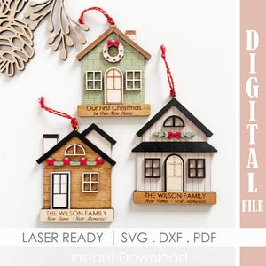 May include: Wooden house-shaped Christmas ornaments with red hanging strings. One ornament says "Our First Christmas in Our New Home." Two ornaments say "The Wilson Family New Home - New Memories."