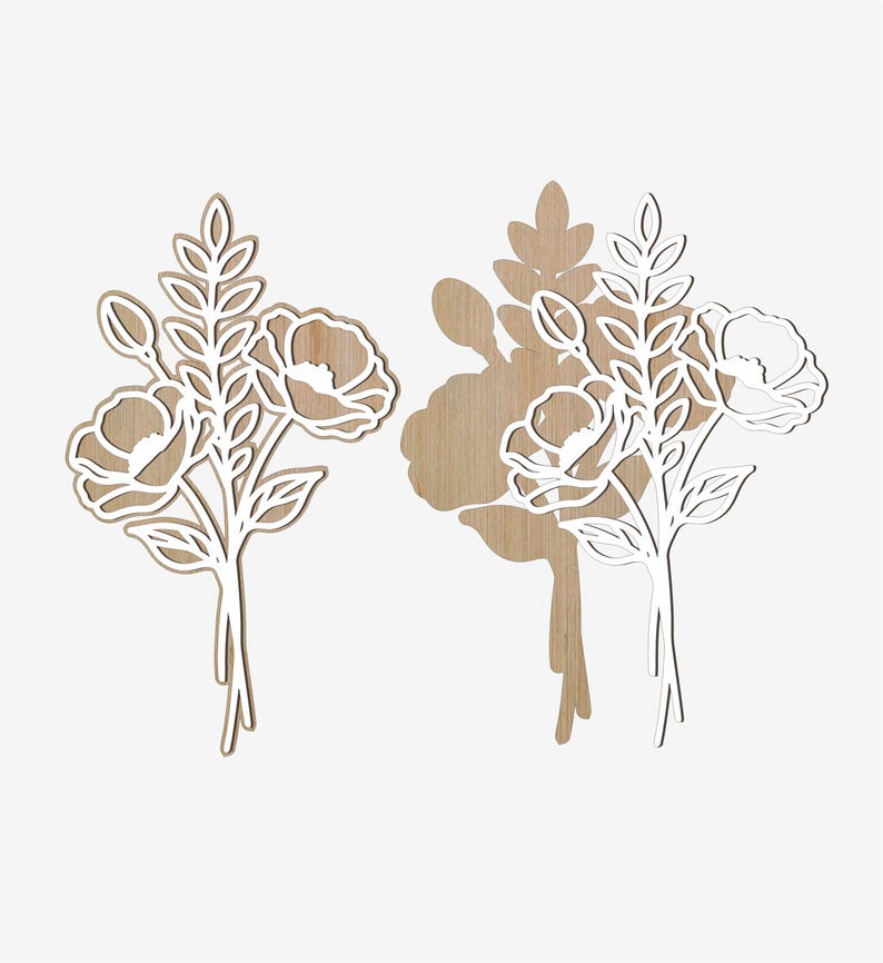 Puede incluir: Dos recortes florales de madera. Cada uno presenta un ramo de flores y hojas con un contorno blanco. Las flores tienen un centro marr&oacute;n claro. El recorte de la derecha proyecta una sombra sobre el fondo blanco. Los recortes florales son probablemente para la decoraci&oacute;n del hogar.