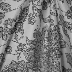 100% Cotton, Black Floral on White Fabric