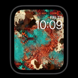 May include: A digital watch face with a turquoise, brown, and white patterned background. The time is 10:09 and the day is Friday, 23rd.