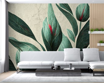 May include: A white couch with two pillows in front of a wall mural featuring a large green leaf pattern with red accents.